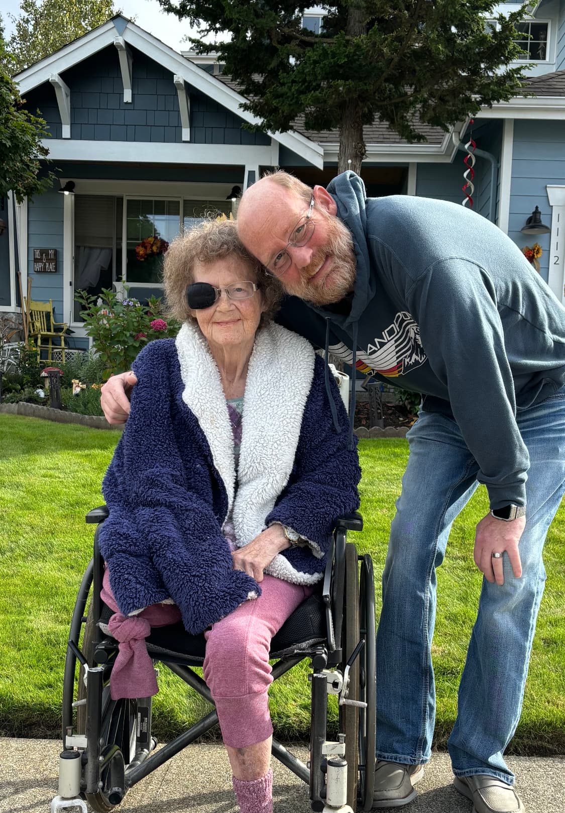 Founder Brian Bresser with his mother in front of a Treasure Valley home