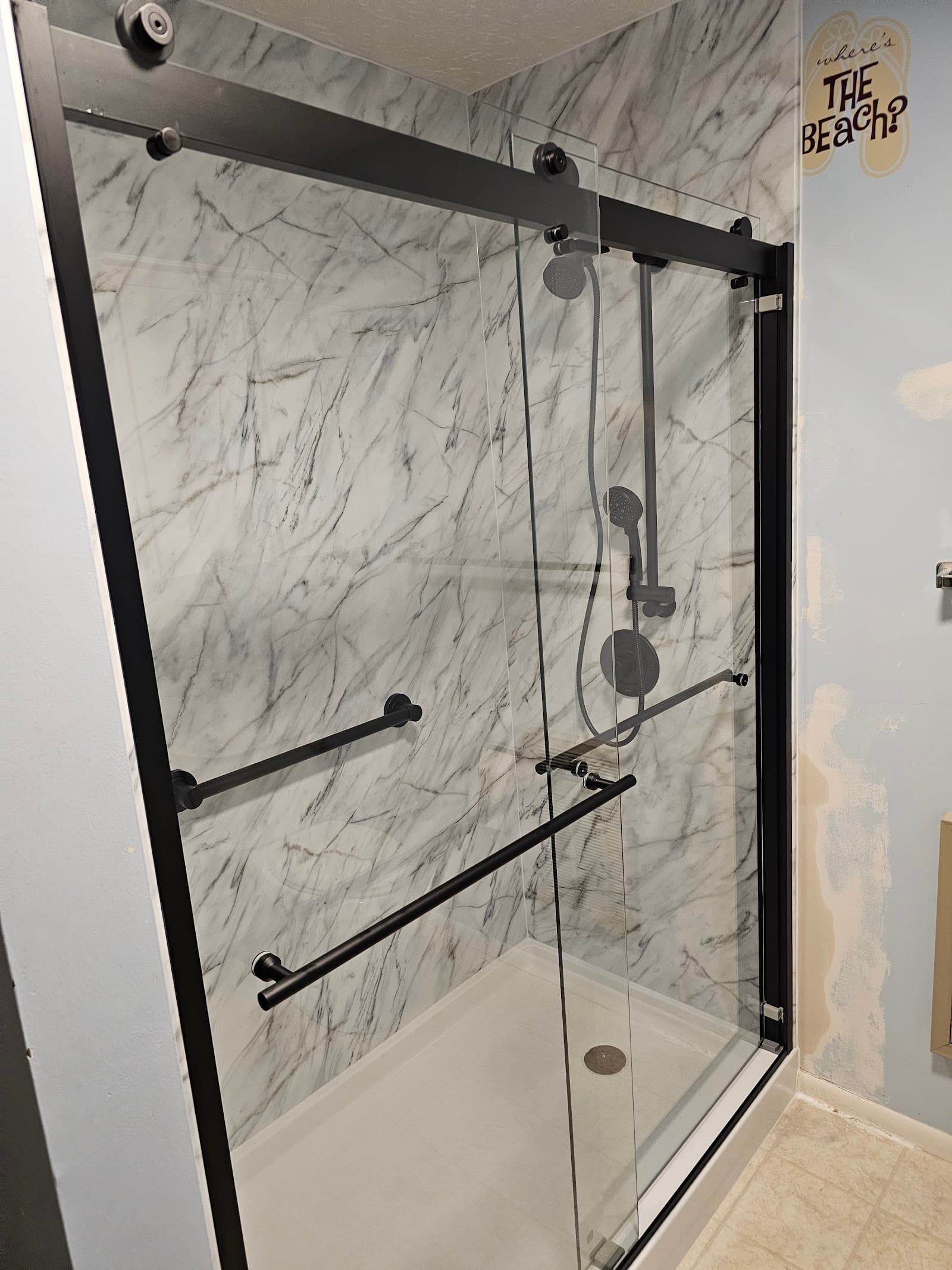 Marble shower with matte black fixtures